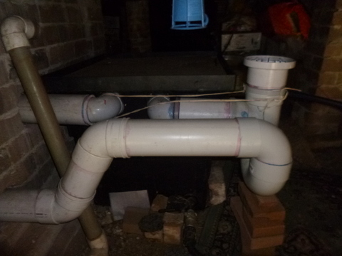 Pipes from the laundry and bathroom into the pit