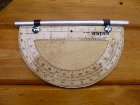 Protractor, backing board with sighting tube attached