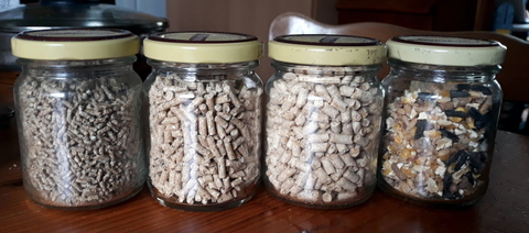 (L to R) chick crumbles, grower pellets, layer pellets. scratch mix