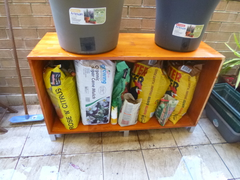 Storage can be provided under large pots, getting them up into the sunlight