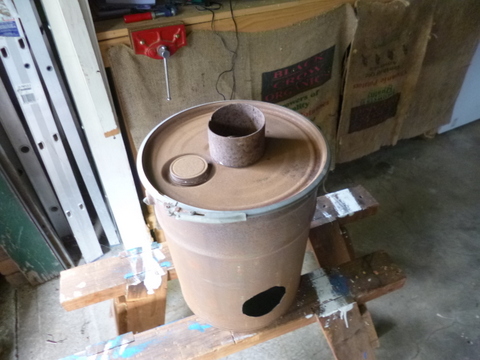 Using a piece of the tube to mark out the hole in the top