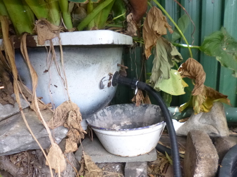 Water discharge from second bathtub onto soil via hose