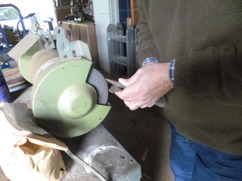 Sharpening a cold chisel using the bench grinder