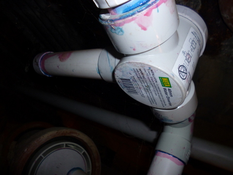 The original discharge pipe, blocked by a cap