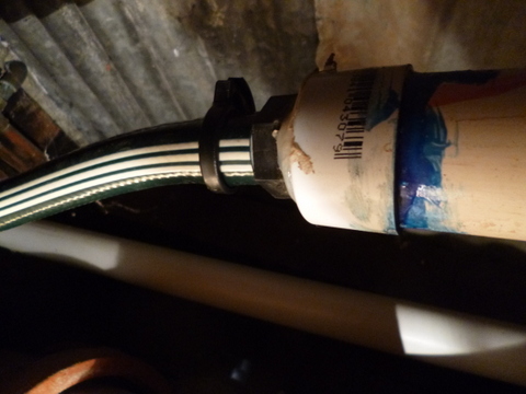 In place with the hose heading out