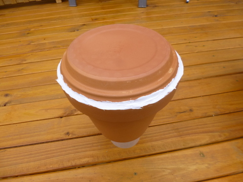 Silicone bead applied to attach saucer to the pot
