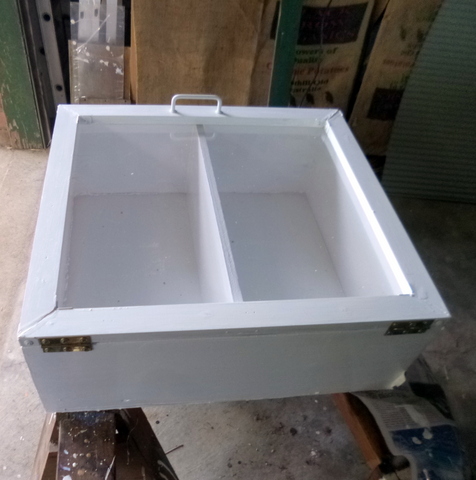 Door attached to carcase, complete with handle