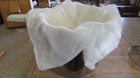 Cheesecloth, colander and catchpot set up