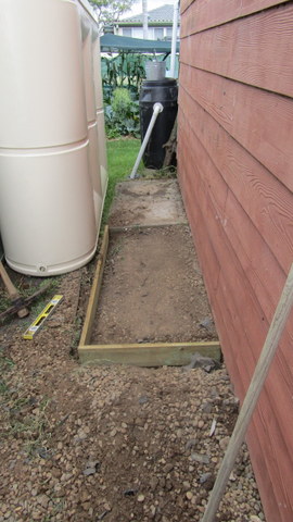 Tank delivered and sitting next to the under construction pad
